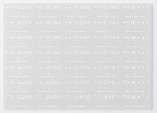 Sheet of white heat seal transfers printed with PRIMARK, size L and Made in Bangladesh